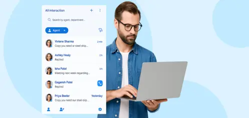 Young man with glasses using laptop with live agent chat dashboard interface